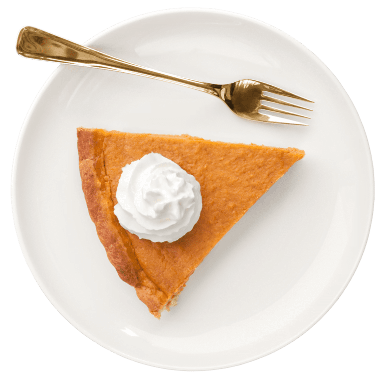 A slice of pumpkin pie topped with whipped cream on a white plate, with a gold fork placed beside it—perfect for savoring after a day of Black Friday 2022 shopping or while giving back during the holiday season.