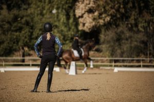 Amelia Newcomb teaching a pirouette to a dressage student.