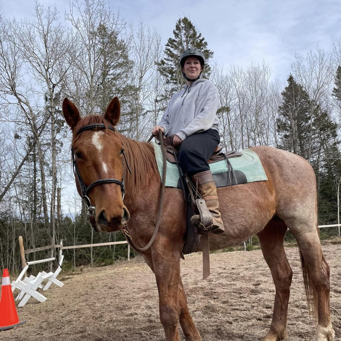 Jessica McDonald posing while on her horse.
